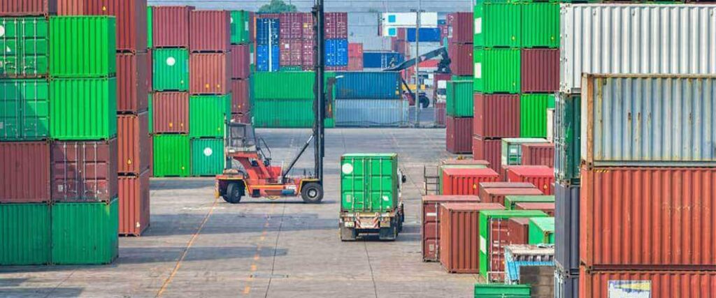 Container being stacked and moved around at a port